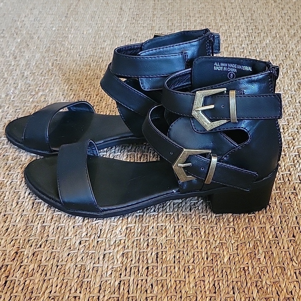 BUMPER black leather gladiator sandals, buckle accents. Size 8.